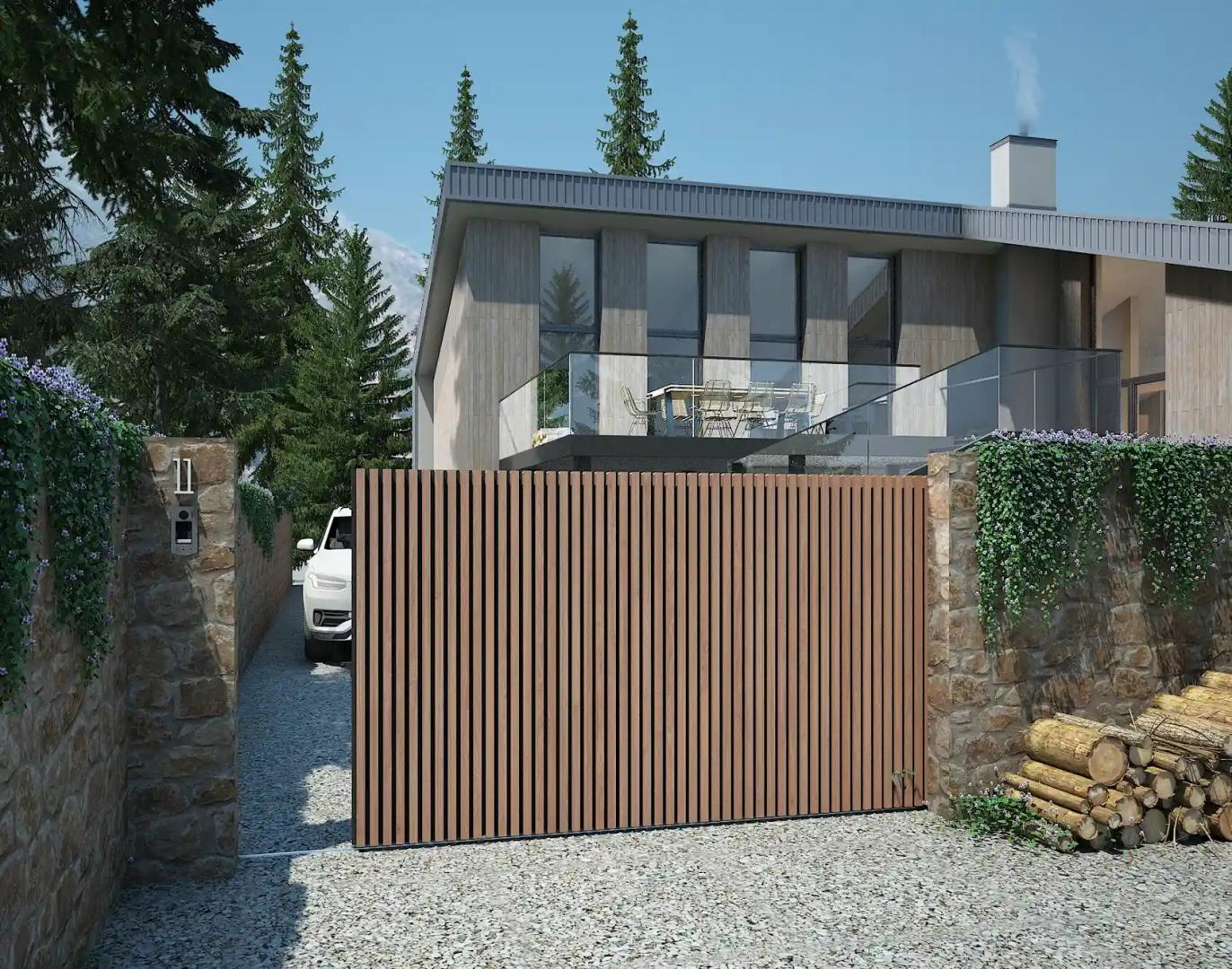 Portail coulissant à lames bois verticales et cadre sombre entre murs en pierre